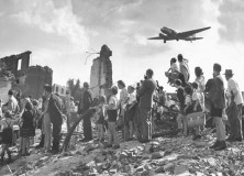 Tattered group of Berliners standing in